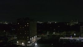 5.7K aerial stock footage orbit an apartment building at nighttime, Detroit, Michigan Aerial Stock Footage | DX0002_198_060