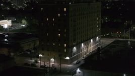 5.7K aerial stock footage of a reverse view of Pasadena Apartments at nighttime, Detroit, Michigan Aerial Stock Footage | DX0002_198_064