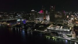 5.7K aerial stock footage stationary view of towering skyscrapers and Hart Plaza at night, Downtown Detroit, Michigan Aerial Stock Footage | DX0002_199_005