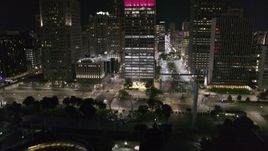 5.7K aerial stock footage Jefferson Avenue seen while descending to Hart Plaza at night, Downtown Detroit, Michigan Aerial Stock Footage | DX0002_199_015