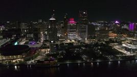 5.7K aerial stock footage orbit Hart Plaza and nearby skyscrapers at night, seen from the river, Downtown Detroit, Michigan Aerial Stock Footage | DX0002_199_018