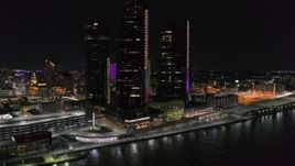 5.7K aerial stock footage of orbiting GM Renaissance Center by the river at night, Downtown Detroit, Michigan Aerial Stock Footage | DX0002_199_027
