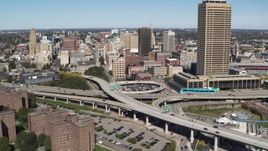 5.7K aerial stock footage of I-190 by city buildings and Seneca One Tower, Downtown Buffalo, New York Aerial Stock Footage | DX0002_200_004