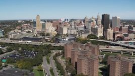 5.7K aerial stock footage of the city's skyline seen while passing apartment buildings, Downtown Buffalo, New York Aerial Stock Footage | DX0002_200_010