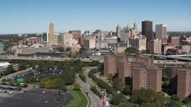 5.7K aerial stock footage of a reverse view of the city's skyline and apartment buildings, Downtown Buffalo, New York Aerial Stock Footage | DX0002_200_011