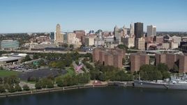 5.7K aerial stock footage of the city's skyline and apartment buildings seen from the river, Downtown Buffalo, New York Aerial Stock Footage | DX0002_200_012