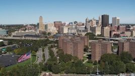 5.7K aerial stock footage focus on skyline and descend past apartment buildings, Downtown Buffalo, New York Aerial Stock Footage | DX0002_200_016