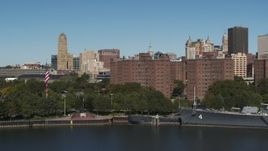 5.7K aerial stock footage descend by river near Marine Drive Apartments, Downtown Buffalo, New York Aerial Stock Footage | DX0002_201_007