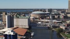 5.7K aerial stock footage flyby KeyBank Center arena and grain elevator by the river, Downtown Buffalo, New York Aerial Stock Footage | DX0002_201_016