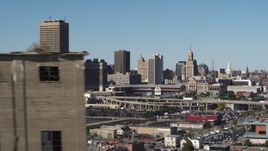 5.7K aerial stock footage of the city's skyline behind baseball stadium, reveal grain elevator, Downtown Buffalo, New York Aerial Stock Footage | DX0002_201_032