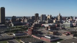 5.7K aerial stock footage ascend away from Erie Community College, baseball stadium, office towers in Downtown Buffalo, New York Aerial Stock Footage | DX0002_202_013