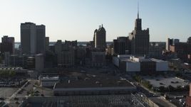 5.7K aerial stock footage descend and fly away from a trio of office towers in Downtown Buffalo, New York Aerial Stock Footage | DX0002_203_007