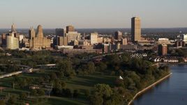5.7K aerial stock footage of the city's skyline at sunset, seen from La Salle Park, Downtown Buffalo, New York Aerial Stock Footage | DX0002_203_034
