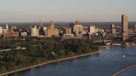 5.7K aerial stock footage of the downtown skyline seen from the lakeside park at sunset, Downtown Buffalo, New York Aerial Stock Footage | DX0002_203_040