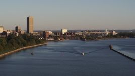5.7K aerial stock footage of Seneca One Tower near the Buffalo River at sunset, Downtown Buffalo, New York Aerial Stock Footage | DX0002_203_042