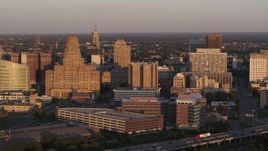 5.7K aerial stock footage of a view of city hall beside courthouse and office buildings at sunset, Downtown Buffalo, New York Aerial Stock Footage | DX0002_204_003