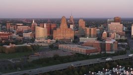 5.7K aerial stock footage of city hall and a courthouse by office buildings at sunset, Downtown Buffalo, New York Aerial Stock Footage | DX0002_204_022