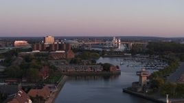 5.7K aerial stock footage of the Buffalo Skyway behind marina at sunset, Downtown Buffalo, New York Aerial Stock Footage | DX0002_204_026