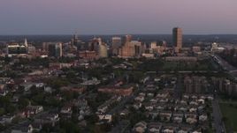 5.7K aerial stock footage of flying by the city's skyline at twilight, Downtown Buffalo, New York Aerial Stock Footage | DX0002_204_029