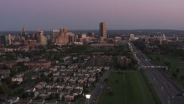 5.7K aerial stock footage wide view of Seneca One Tower and the city's skyline seen from I-190 at twilight, Downtown Buffalo, New York Aerial Stock Footage | DX0002_204_032