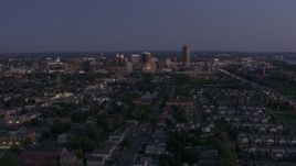 5.7K aerial stock footage of the skyline seen from apartments and homes at twilight, Downtown Buffalo, New York Aerial Stock Footage | DX0002_204_043
