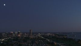 5.7K aerial stock footage of the moon high above the city's skyline at twilight, Downtown Buffalo, New York Aerial Stock Footage | DX0002_204_048