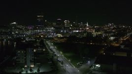 5.7K aerial stock footage of a reverse view of the skyline at night, Downtown Buffalo, New York Aerial Stock Footage | DX0002_205_008