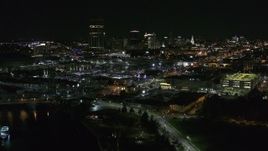 5.7K aerial stock footage of the skyline while descending by river at night, Downtown Buffalo, New York Aerial Stock Footage | DX0002_205_012