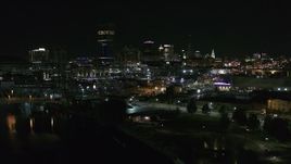 5.7K aerial stock footage approach the skyline from river and parking lots at night, Downtown Buffalo, New York Aerial Stock Footage | DX0002_205_013