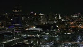 5.7K aerial stock footage of flying by skyscraper and office towers at night, Downtown Buffalo, New York Aerial Stock Footage | DX0002_205_027