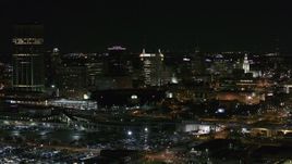 5.7K aerial stock footage of passing by a skyscraper and office towers at night, Downtown Buffalo, New York Aerial Stock Footage | DX0002_205_028