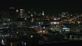 5.7K aerial stock footage of a view of office towers an city buildings at night, Downtown Buffalo, New York Aerial Stock Footage | DX0002_205_031