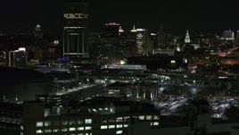 5.7K aerial stock footage of flying by the skyline seen from parking lots at night, Downtown Buffalo, New York Aerial Stock Footage | DX0002_205_034