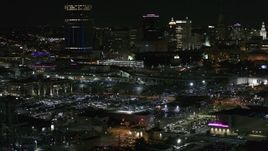 5.7K aerial stock footage of passing by the skyline seen from parking lots at night, Downtown Buffalo, New York Aerial Stock Footage | DX0002_205_035