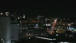 5.7K aerial stock footage of distant Buffalo General Medical Center seen from grain elevators at night, Downtown Buffalo, New York Aerial Stock Footage | DX0002_205_039