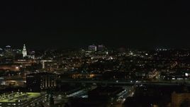 5.7K aerial stock footage of distant Buffalo General Medical Center at night during descent, Downtown Buffalo, New York Aerial Stock Footage | DX0002_205_041