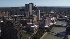 5.7K aerial stock footage a stationary view of riverfront hotels and the city's skyline, Downtown Rochester, New York Aerial Stock Footage | DX0002_206_003