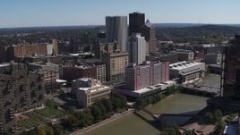 5.7K aerial stock footage orbiting riverfront hotels and the city's skyline, Downtown Rochester, New York Aerial Stock Footage | DX0002_206_004