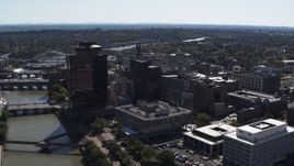 5.7K aerial stock footage stationary view of office buildings by the Genessee River, Downtown Rochester, New York Aerial Stock Footage | DX0002_206_012
