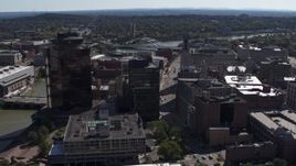 5.7K aerial stock footage or circling office buildings and hotel by the Genessee River, Downtown Rochester, New York Aerial Stock Footage | DX0002_206_016