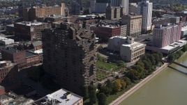 5.7K aerial stock footage orbit and approach riverfront apartment complex in Downtown Rochester, New York Aerial Stock Footage | DX0002_206_023