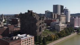 5.7K aerial stock footage orbit riverfront apartment complex overlooking the river, Downtown Rochester, New York Aerial Stock Footage | DX0002_206_025