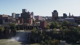 5.7K aerial stock footage reverse view of the city's skyline and river, reveal the falls, Downtown Rochester, New York Aerial Stock Footage | DX0002_206_033