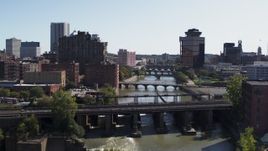 5.7K aerial stock footage fly over falls and river bridges toward First Federal Plaza, Downtown Rochester, New York Aerial Stock Footage | DX0002_206_035