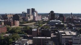 5.7K aerial stock footage descend while focused on skyline and office tower, Downtown Rochester, New York Aerial Stock Footage | DX0002_206_042