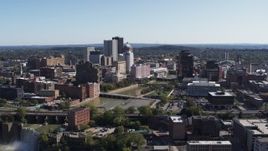 5.7K aerial stock footage reverse view of river bridges and skyline, reveal the waterfall, Downtown Rochester, New York Aerial Stock Footage | DX0002_207_006