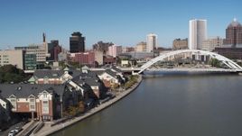 5.7K aerial stock footage flyby riverfront apartments toward Douglass-Anthony Bridge in Downtown Rochester, New York Aerial Stock Footage | DX0002_207_019