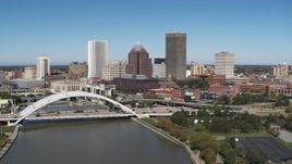 5.7K aerial stock footage slowly fly away from the skyline and Douglass-Anthony Bridge, Downtown Rochester, New York Aerial Stock Footage | DX0002_207_025