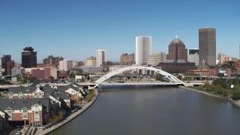 5.7K aerial stock footage view of the skyline behind the Douglass-Anthony Bridge, Downtown Rochester, New York Aerial Stock Footage | DX0002_207_031