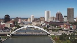 5.7K aerial stock footage fly over the Douglass-Anthony Bridge and past the skyline, Downtown Rochester, New York Aerial Stock Footage | DX0002_207_032